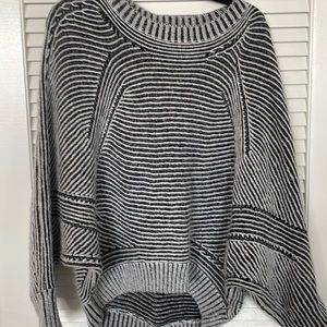 Navy and white knit poncho sweater with sleeves